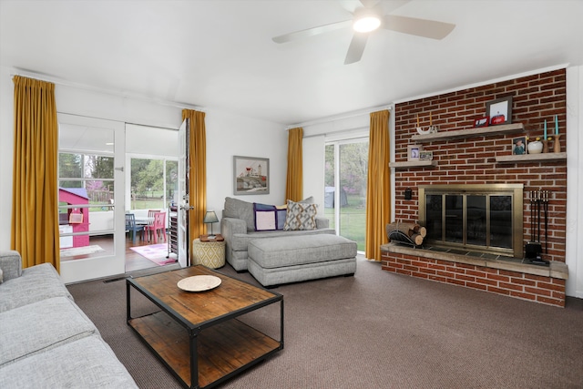 carpeted living area with a ceiling fan and a brick fireplace