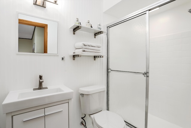 full bath featuring vanity, a shower stall, and toilet