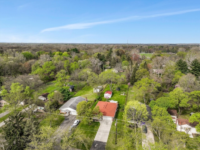 birds eye view of property with a view of trees