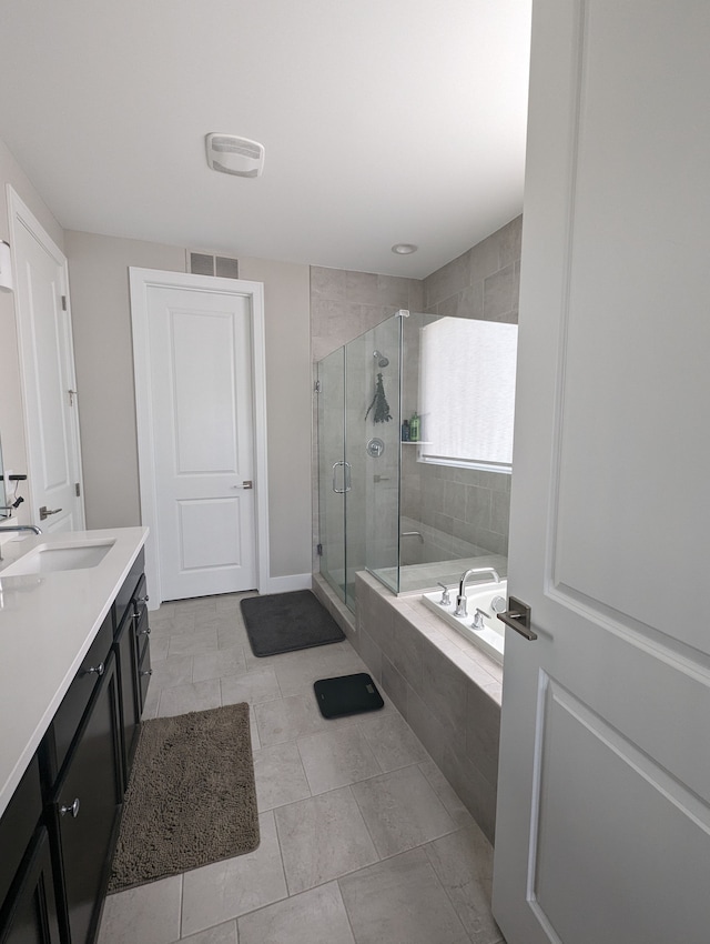 2298 Pondview Ln, Troy, MI 48085 - bathroom featuring a bath, visible vents, tile patterned flooring, a shower stall, and vanity