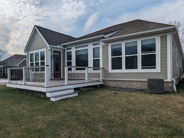 2298 Pondview Ln, Troy, MI 48085 - back of house with central air condition unit, roof with shingles, a wooden deck, and a yard