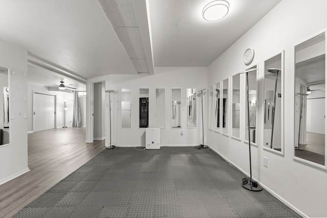 empty room featuring baseboards and a ceiling fan