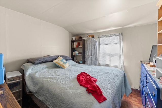 bedroom featuring lofted ceiling