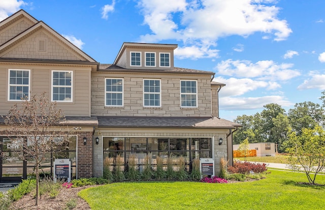 1569 Addison Cir, Walled Lake, MI 48390 - rear view of property with roof with shingles and a yard