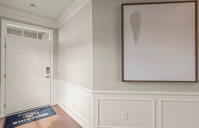1569 Addison Cir, Walled Lake, MI 48390 - doorway with ornamental molding, a decorative wall, wood finished floors, and a wainscoted wall