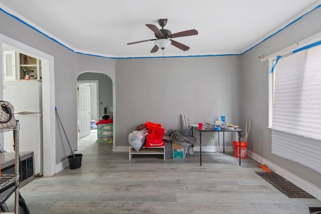 8690 Elmira St, Detroit, MI 48204 - game room featuring arched walkways, ceiling fan, wood finished floors, and baseboards
