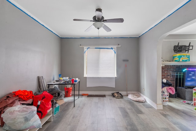 8690 Elmira St, Detroit, MI 48204 - rec room featuring wood finished floors, ceiling fan, arched walkways, and baseboards