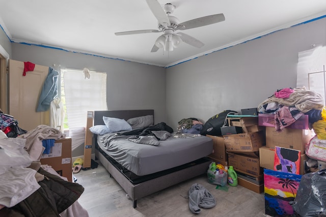 8690 Elmira St, Detroit, MI 48204 - bedroom with wood finished floors, a ceiling fan, and ornamental molding
