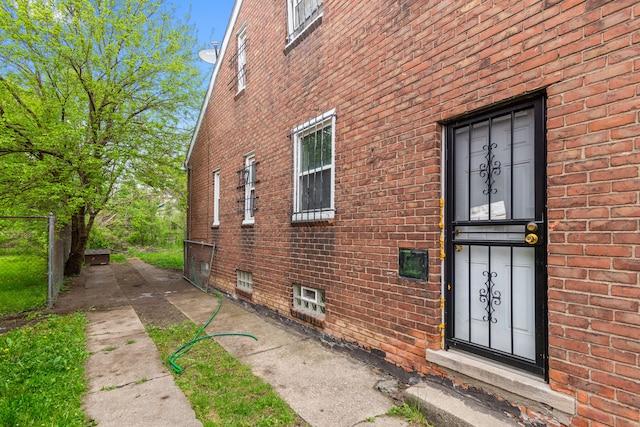 8690 Elmira St, Detroit, MI 48204 - entrance to property featuring brick siding and fence