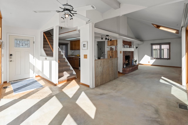 unfurnished living room featuring visible vents, baseboards, light carpet, and a fireplace