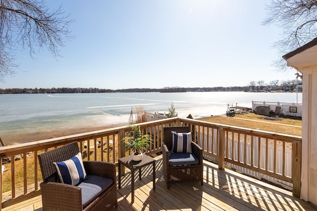 wooden deck with a water view