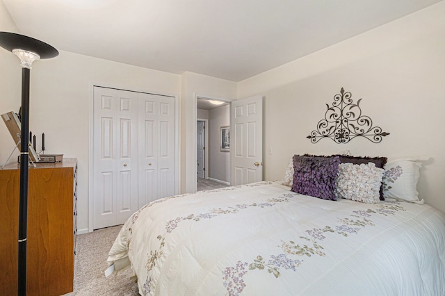 bedroom with light colored carpet and a closet
