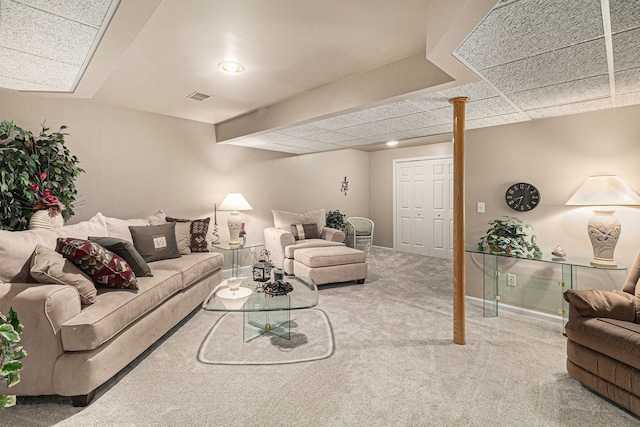 living area with baseboards, carpet, and visible vents