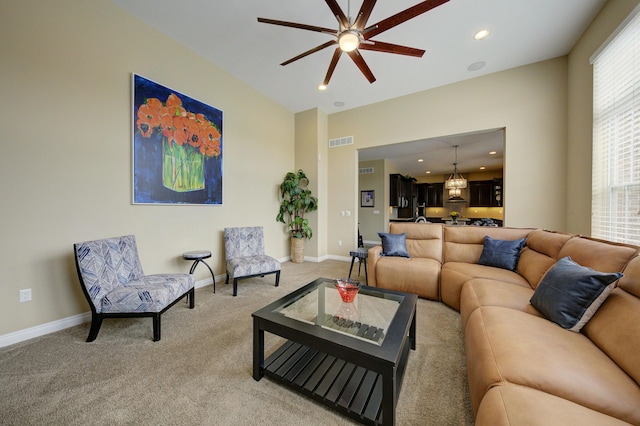 living area featuring ceiling fan, light colored carpet, visible vents, baseboards, and recessed lighting