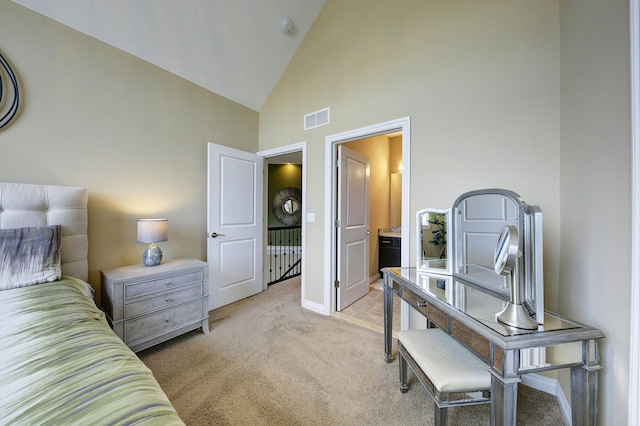 bedroom featuring high vaulted ceiling, baseboards, light colored carpet, and visible vents