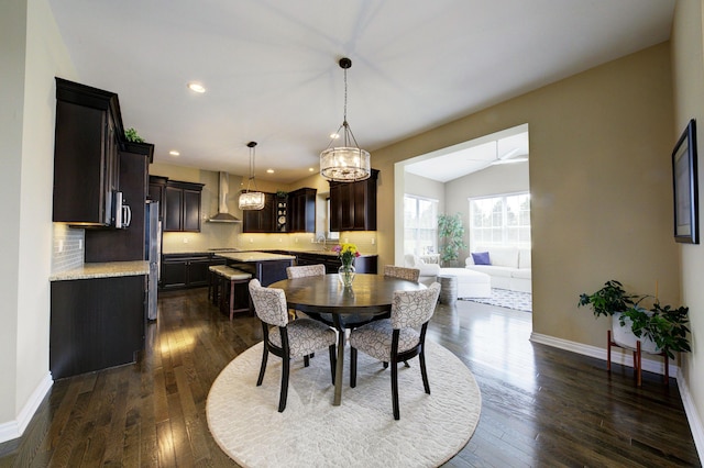 dining room with recessed lighting, baseboards, an inviting chandelier, and dark wood-type flooring