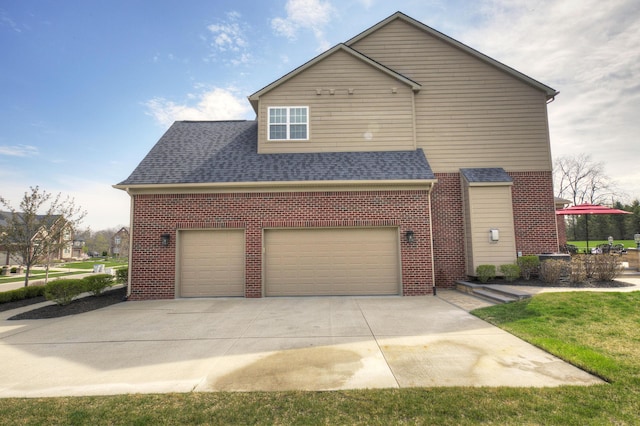 view of home's exterior with a shingled roof, concrete driveway, and brick siding