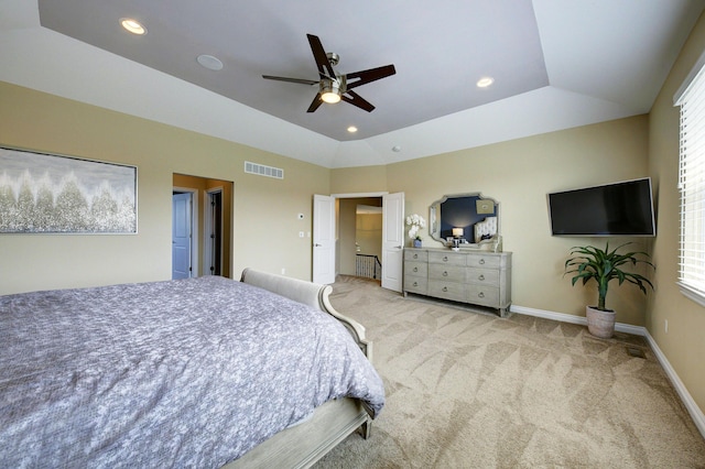 carpeted bedroom featuring a ceiling fan, visible vents, baseboards, lofted ceiling, and recessed lighting
