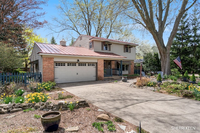 traditional home with brick siding, concrete driveway, an attached garage, and a porch