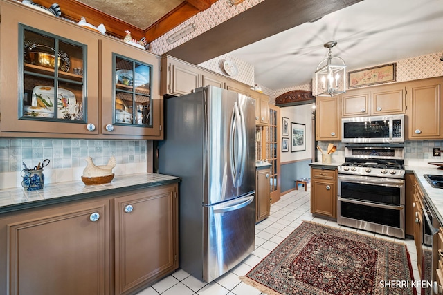 kitchen with decorative backsplash, decorative light fixtures, glass insert cabinets, stainless steel appliances, and light tile patterned flooring
