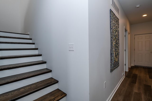 stairs featuring baseboards, recessed lighting, wood finished floors, and visible vents