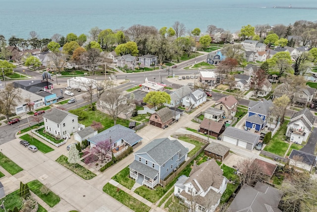 birds eye view of property with a residential view and a water view