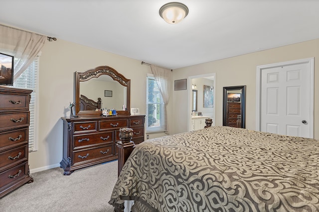 carpeted bedroom with connected bathroom