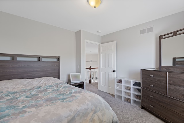 carpeted bedroom with visible vents