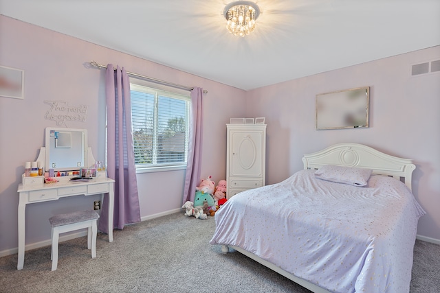 bedroom featuring carpet flooring, baseboards, visible vents, and an inviting chandelier