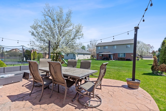 view of patio with a playground, a trampoline, and outdoor dining space
