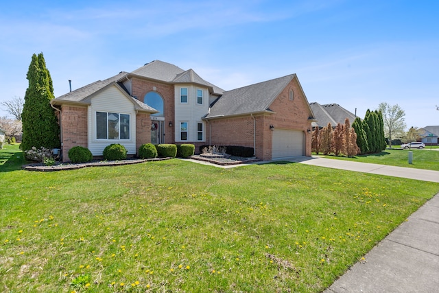 traditional home with brick siding, a garage, driveway, and a front yard