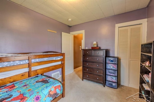 bedroom featuring carpet floors and visible vents
