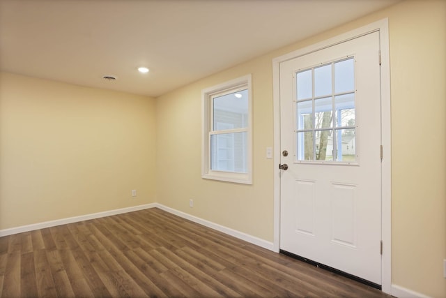 doorway with baseboards, recessed lighting, and dark wood-type flooring