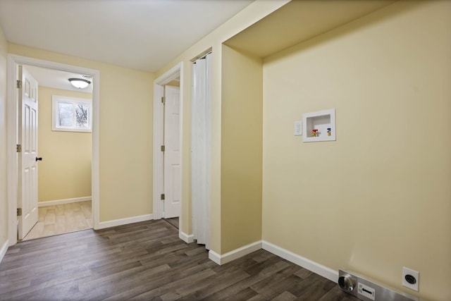laundry room with laundry area, hookup for a washing machine, electric dryer hookup, baseboards, and dark wood-style floors