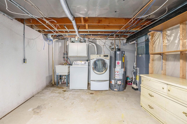 unfinished below grade area featuring washer and dryer, a sink, and gas water heater