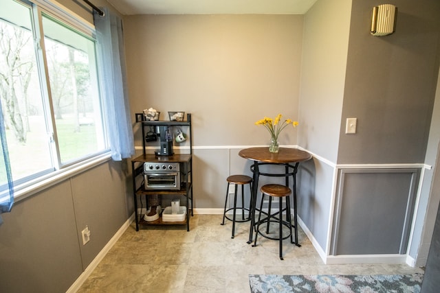 dining area with baseboards and a wealth of natural light