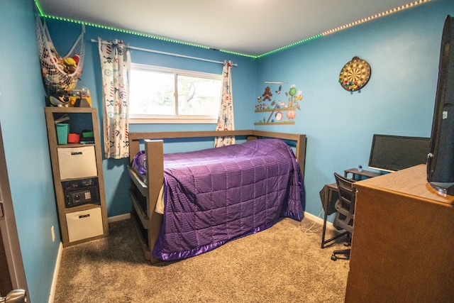 bedroom featuring carpet flooring and baseboards