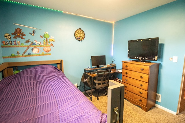 carpeted bedroom featuring visible vents and baseboards
