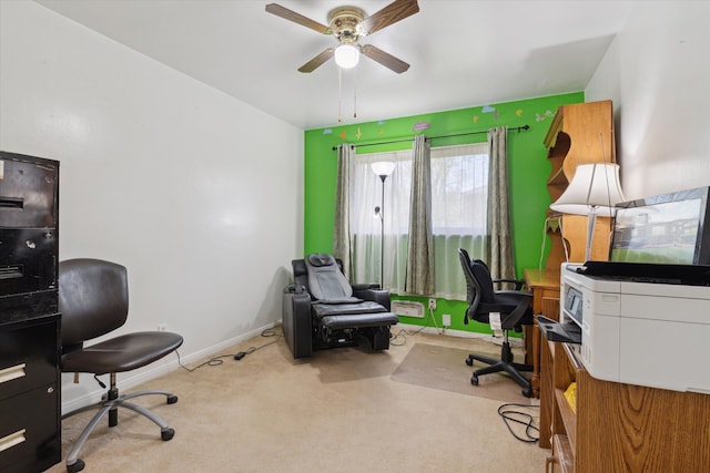 carpeted home office featuring ceiling fan and baseboards