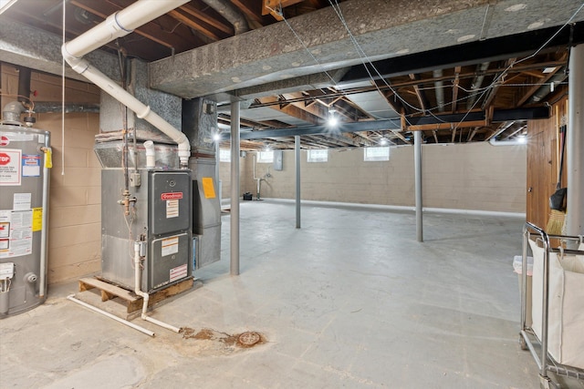below grade area featuring heating unit and water heater