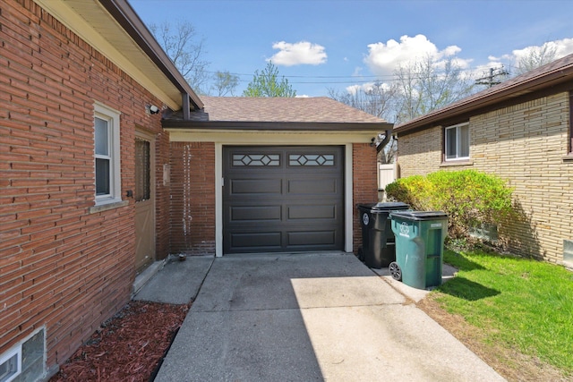 garage with concrete driveway