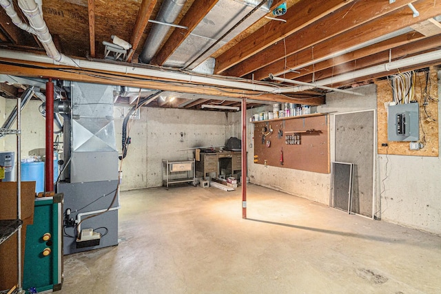 unfinished below grade area featuring heating unit and electric panel