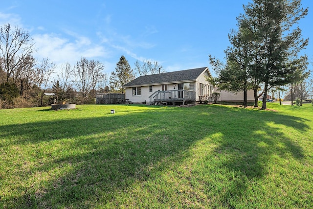 view of yard featuring a wooden deck