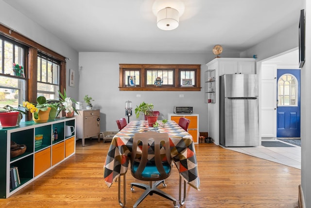 dining space with light wood-type flooring