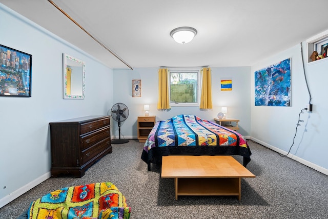 bedroom featuring baseboards and carpet floors