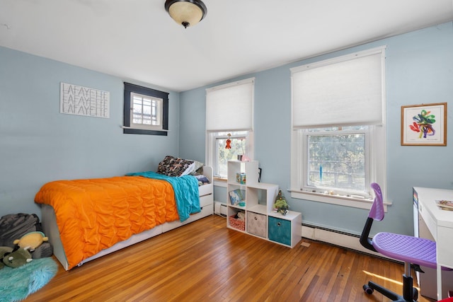 bedroom with wood-type flooring