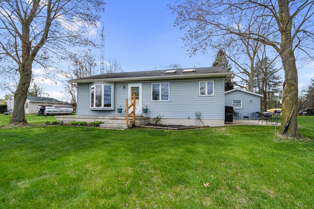 exterior space with a patio and a front yard