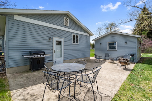 exterior space with outdoor dining area and a patio area