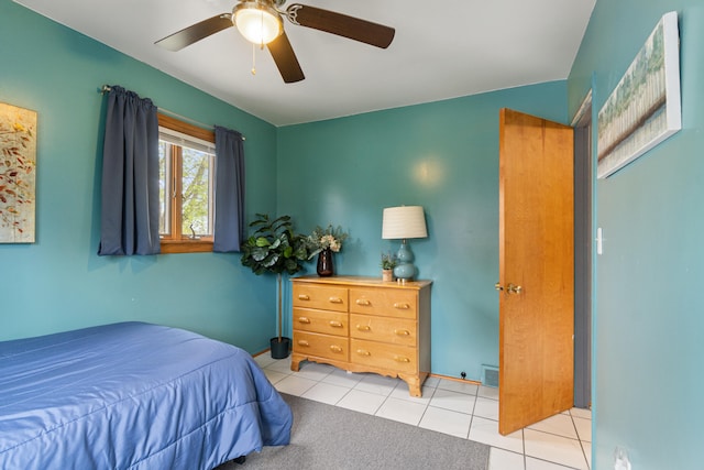 bedroom with tile patterned flooring, a ceiling fan, and visible vents