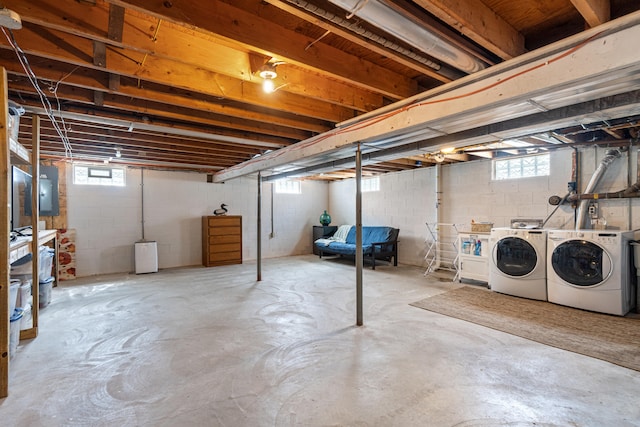 below grade area with washer and clothes dryer